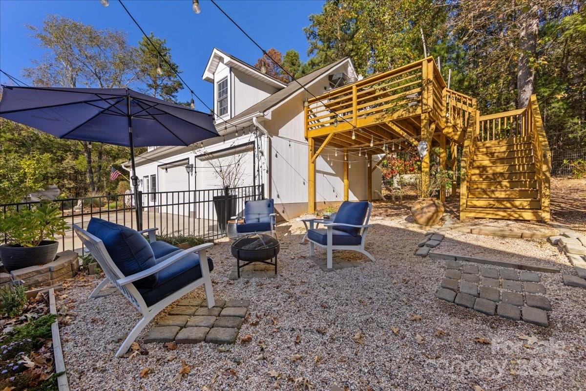 9701 Deer Run Road Waxhaw, NC 28173 - Photo 44 of 47 a view of a chairs and table in the backyard