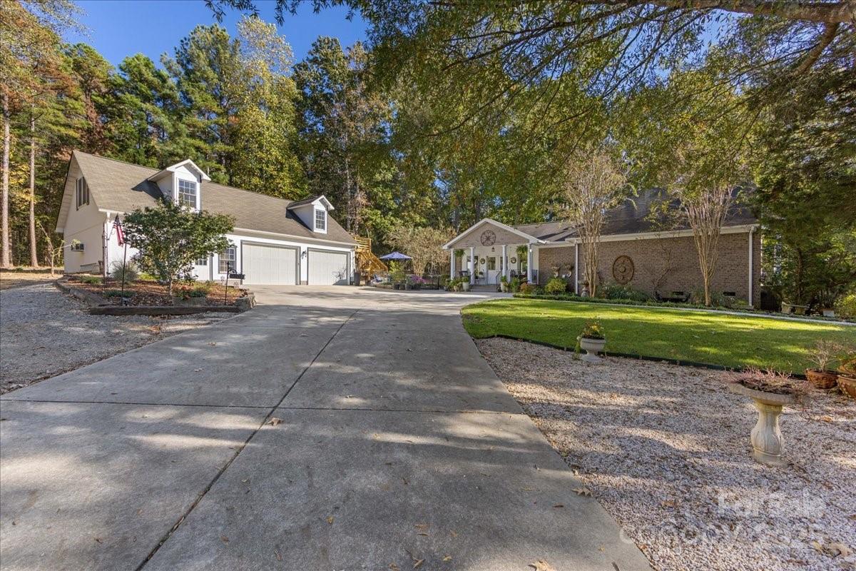 9701 Deer Run Road Waxhaw, NC 28173 - Photo 6 of 47 a view of a house with a yard