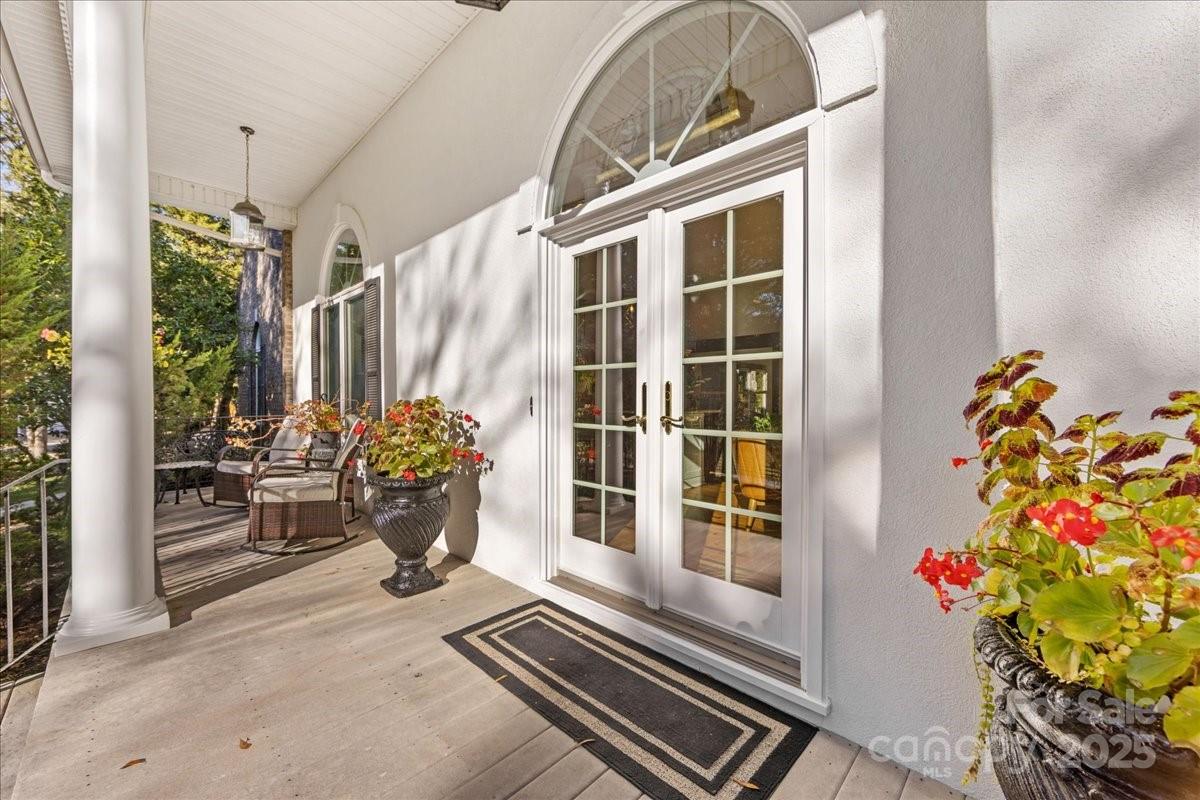 9701 Deer Run Road Waxhaw, NC 28173 - Photo 9 of 47 a view of a porch with a potted plant