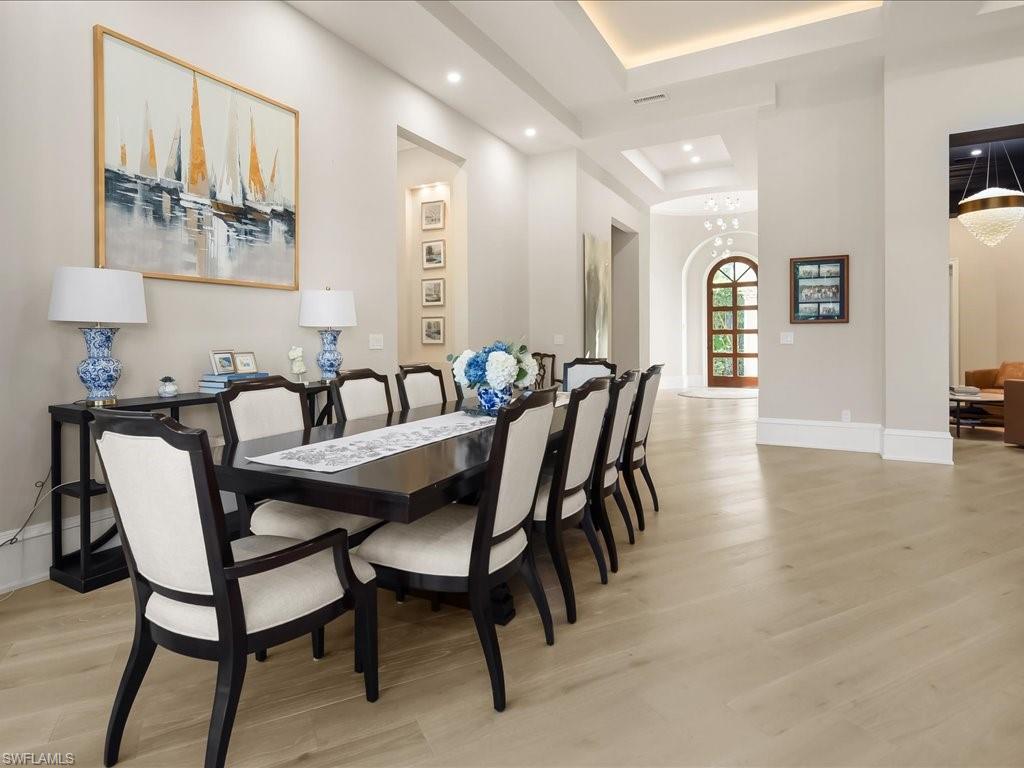 2822 Capistrano Way Naples, FL 34105 - Photo 13 of 47 Living area featuring European White Oak wood flooring, and dramatic ceiling details.