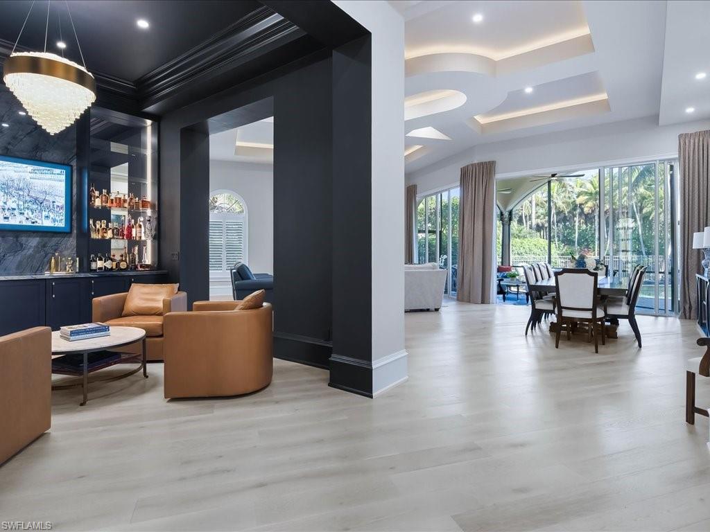 2822 Capistrano Way Naples, FL 34105 - Photo 15 of 47 Custom bar/cocktails room with dramatic lighting, icemaker and wine refrigerator.