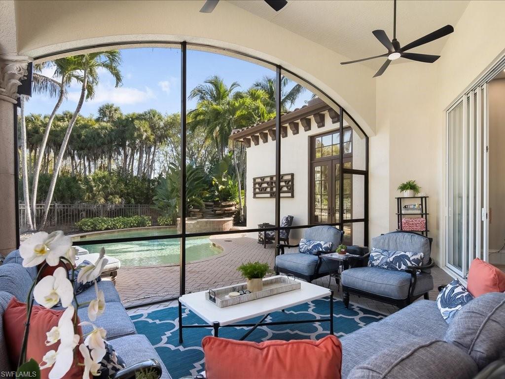 2822 Capistrano Way Naples, FL 34105 - Photo 20 of 47 Screened patio looking into the pool and spa area.