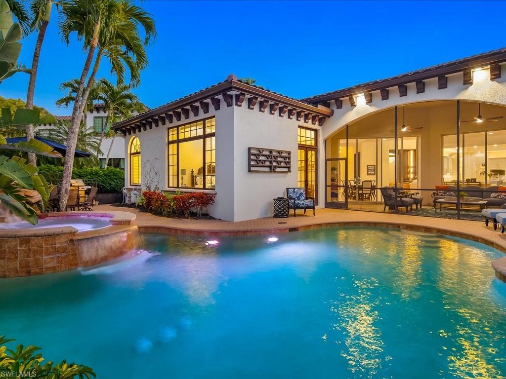 2822 Capistrano Way Naples, FL 34105 - Photo 2 of 47 Mediterranean / spanish-style house featuring pool, spa, and screened in lanai.