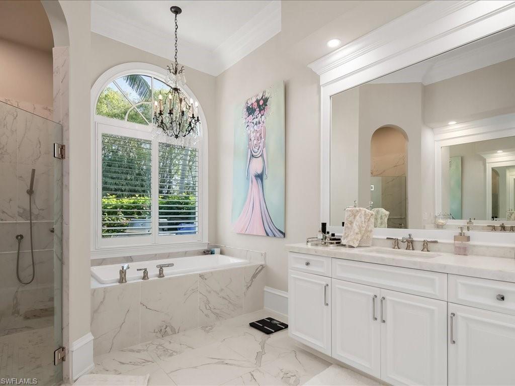 2822 Capistrano Way Naples, FL 34105 - Photo 24 of 47 Updated primary bathroom with dual sinks, separate shower and tub