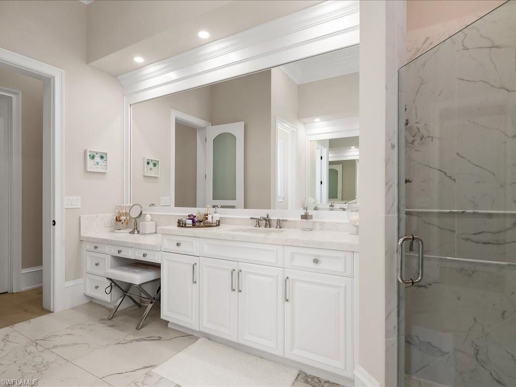 2822 Capistrano Way Naples, FL 34105 - Photo 25 of 47 Updated primary bathroom with dual sinks, separate shower and tub