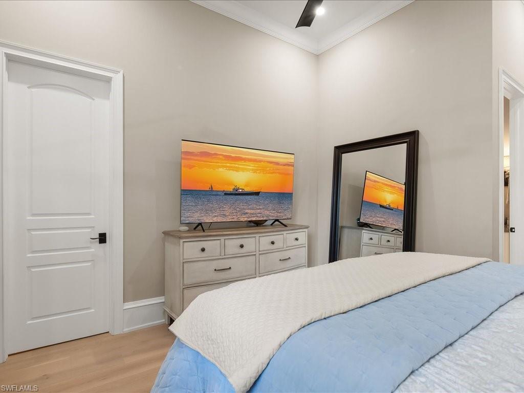2822 Capistrano Way Naples, FL 34105 - Photo 28 of 47 Guest Bedroom with ensuite bathroom and European White Oak wood flooring.