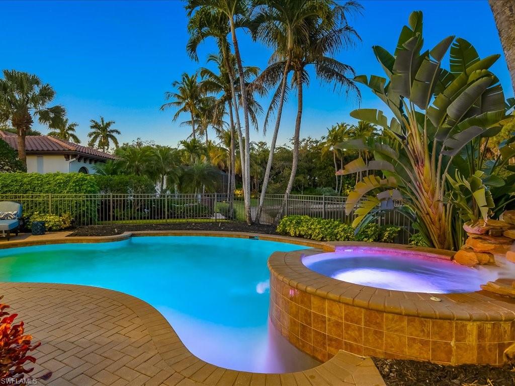2822 Capistrano Way Naples, FL 34105 - Photo 38 of 47 Relaxing heated pool / spa featuring a fenced backyard and a patio