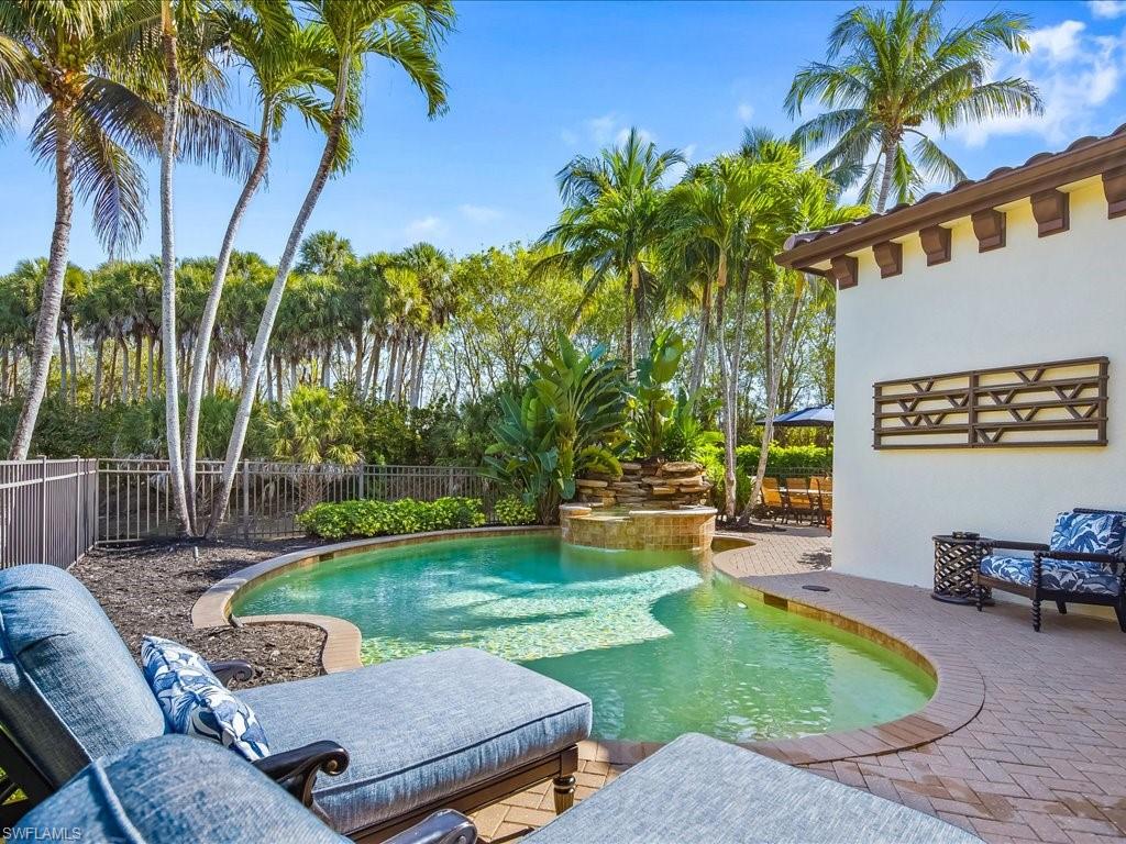 2822 Capistrano Way Naples, FL 34105 - Photo 40 of 47 View of swimming pool with patio surround and a fenced backyard