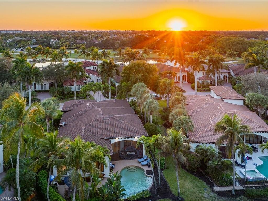 2822 Capistrano Way Naples, FL 34105 - Photo 45 of 47 Aerial view at dusk of view of pool and a residential view
