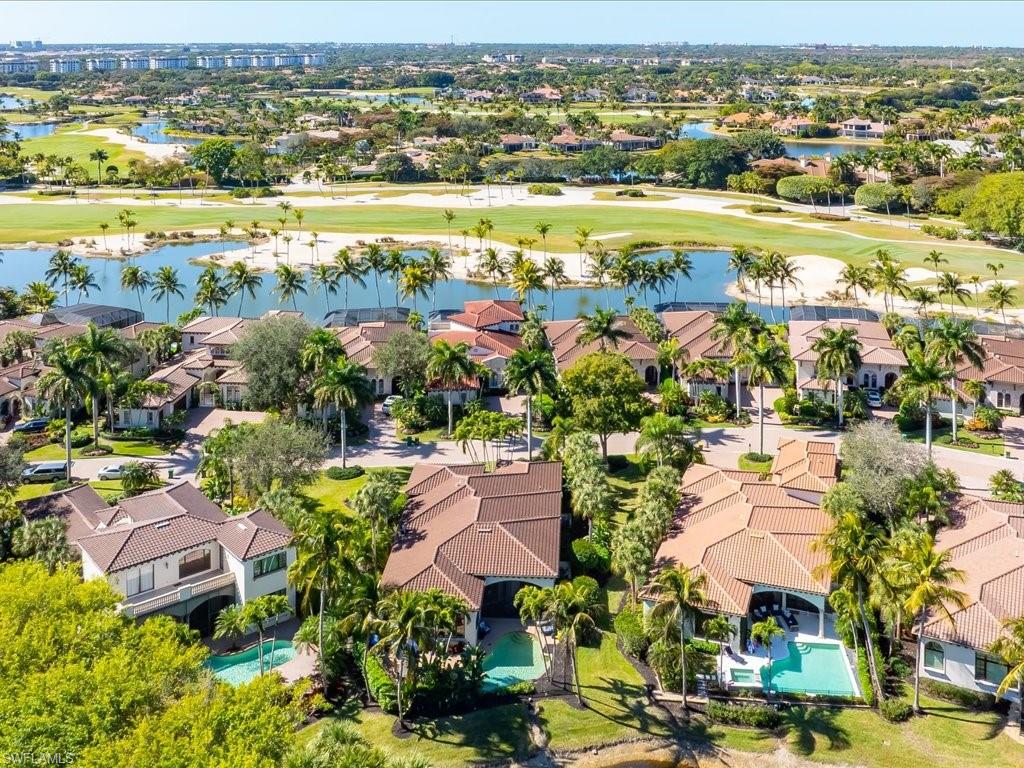 2822 Capistrano Way Naples, FL 34105 - Photo 46 of 47 Aerial view of residential area of Capistrano with the golf course and a lake in the background