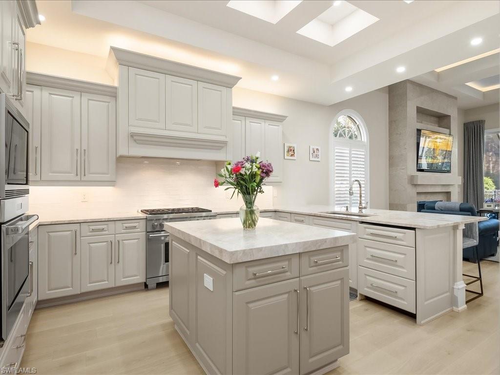 2822 Capistrano Way Naples, FL 34105 - Photo 5 of 47 Light, bright gourmet kitchen with Sub-zero, Wolff, and Bosch appliances. Dual refrigerater drawers, icemaker and leathered Taj Mahal quartzite countertops provide a luxurious feel.