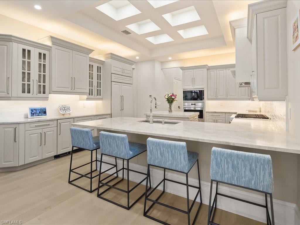 2822 Capistrano Way Naples, FL 34105 - Photo 8 of 47 Light, bright gourmet kitchen with Sub-zero, Wolff, and Bosch appliances. Dual refrigerater drawers, icemaker and leathered Taj Mahal quartzite countertops provide a luxurious feel.