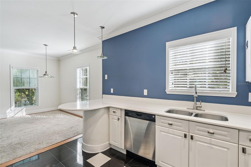 414 Water Street, Unit 414 Celebration, FL 34747 - Photo 17 of 75 a kitchen with a sink and large window