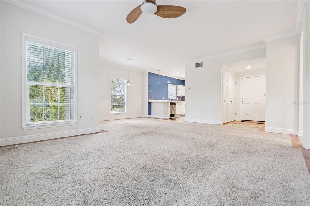 414 Water Street, Unit 414 Celebration, FL 34747 - Photo 21 of 75 a view of empty room with a kitchen and window