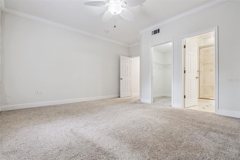 414 Water Street, Unit 414 Celebration, FL 34747 - Photo 30 of 75 a view of an empty room with a ceiling fan