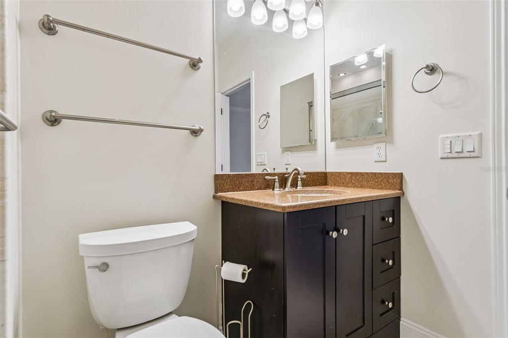 414 Water Street, Unit 414 Celebration, FL 34747 - Photo 32 of 75 a bathroom with a sink toilet and shower