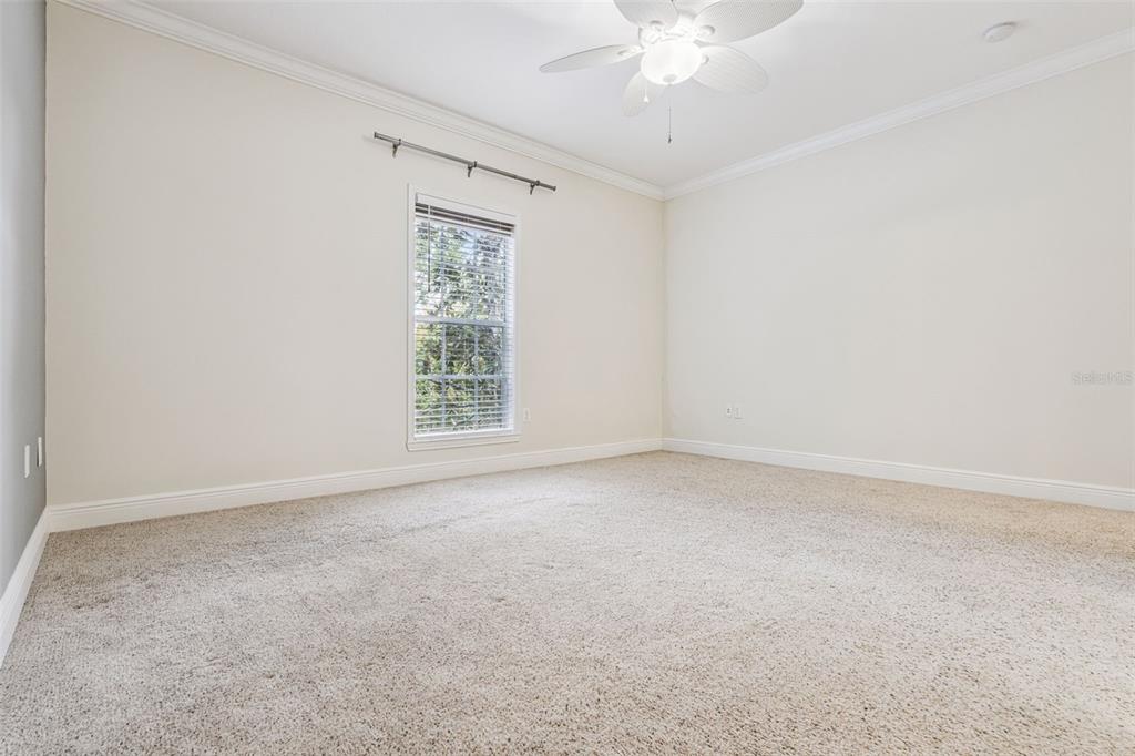 414 Water Street, Unit 414 Celebration, FL 34747 - Photo 36 of 75 an empty room with a window and a fan