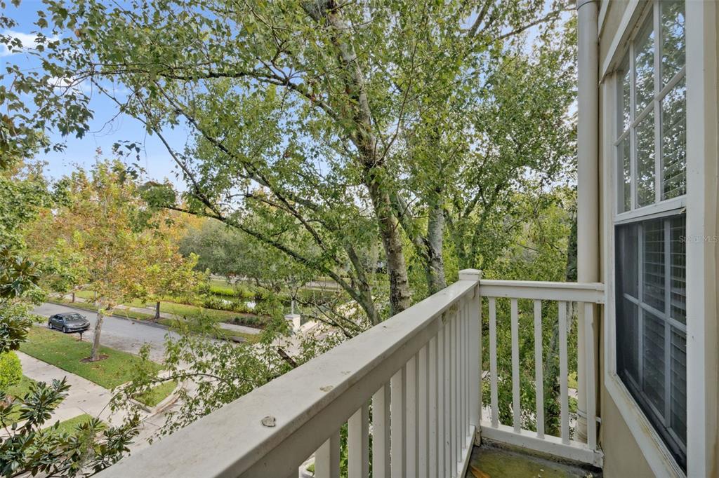 414 Water Street, Unit 414 Celebration, FL 34747 - Photo 43 of 75 a view of a wooden deck and trees