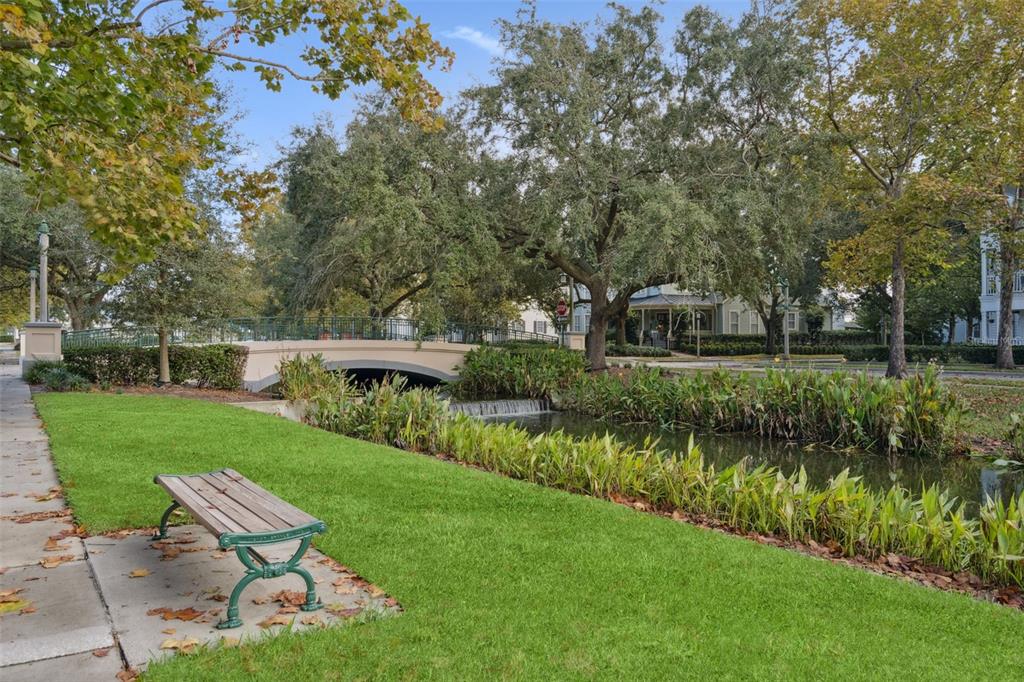 414 Water Street, Unit 414 Celebration, FL 34747 - Photo 45 of 75 a view of a lake with a yard