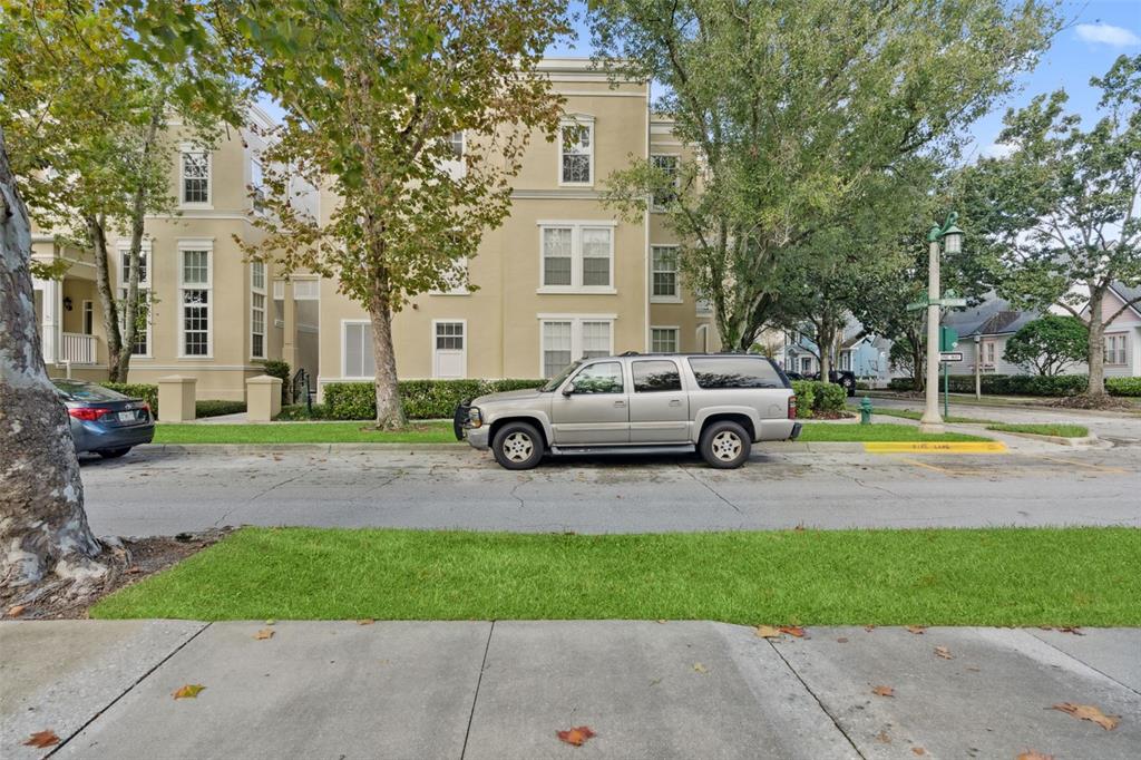 414 Water Street, Unit 414 Celebration, FL 34747 - Photo 6 of 75 a view of a car parked in front of a brick house