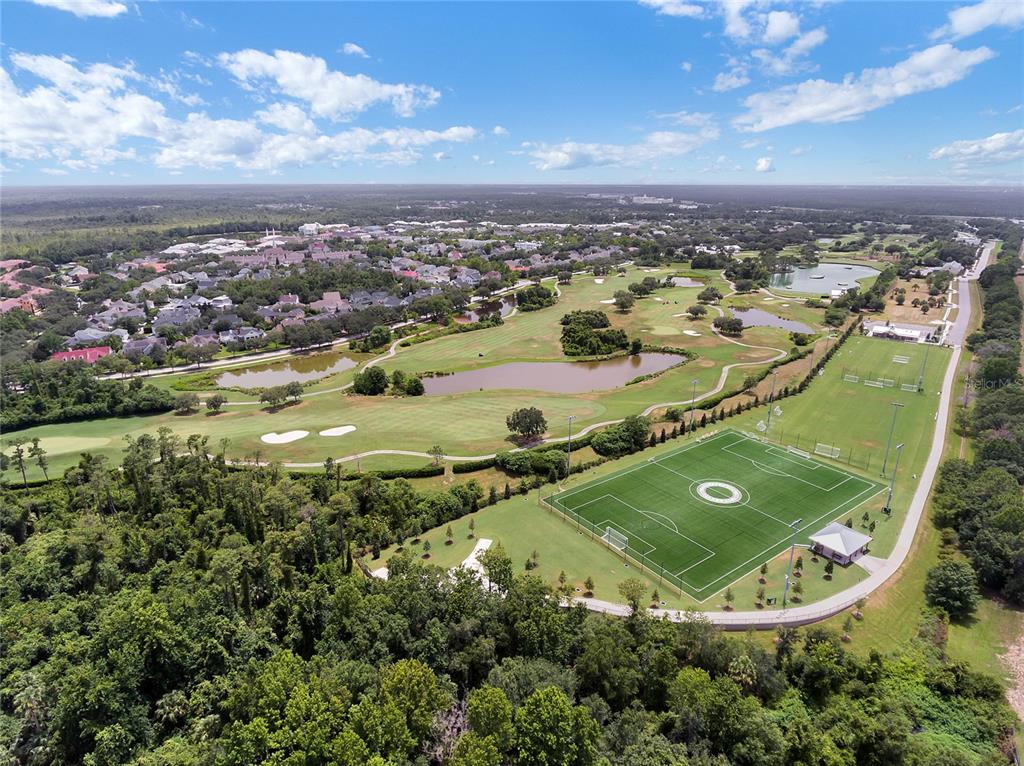 414 Water Street, Unit 414 Celebration, FL 34747 - Photo 67 of 75 an aerial view of a residential houses with outdoor space and swimming pool