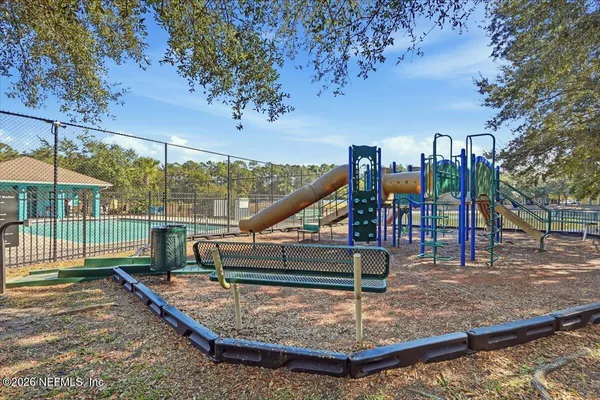 a view of a park with swings