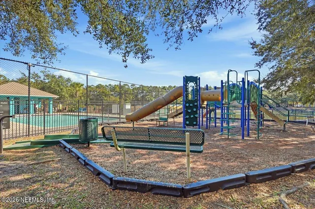 a view of a park with swings