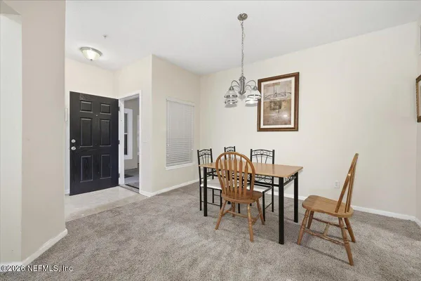 a view of a dining room with furniture
