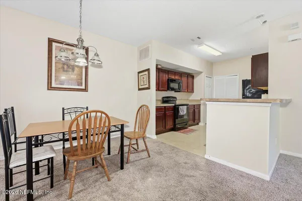 a view of a dining room with furniture