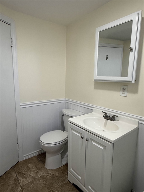 21 Flint Street, Unit 19 Somerville, MA 02145 - Photo 12 of 14 a bathroom with a sink toilet and mirror