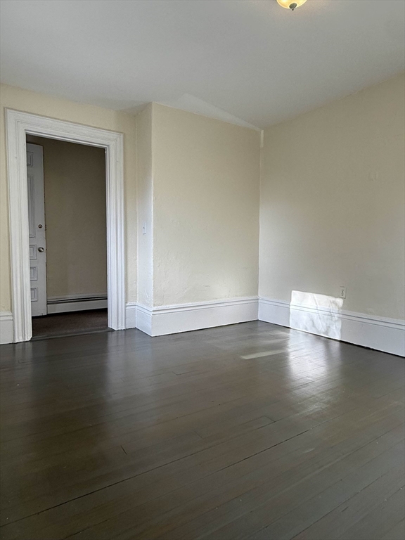 21 Flint Street, Unit 19 Somerville, MA 02145 - Photo 2 of 14 a view of empty room with wooden floor