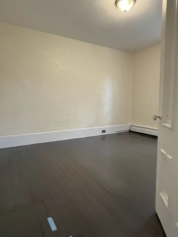 an empty room with a bench