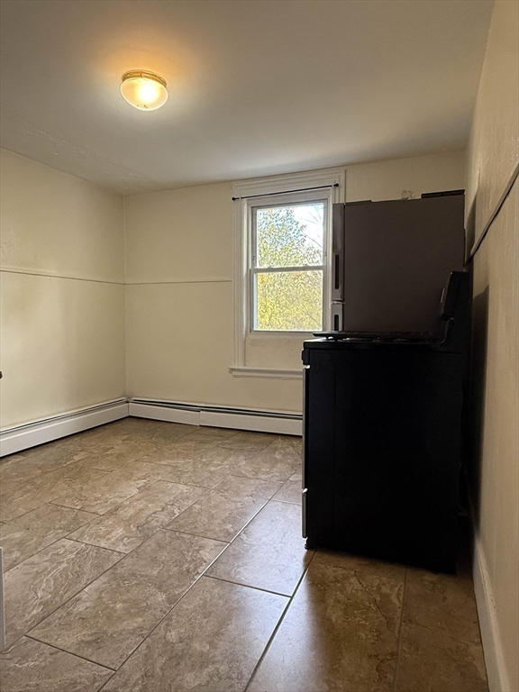 21 Flint Street, Unit 19 Somerville, MA 02145 - Photo 10 of 14 a view of an empty room with a window