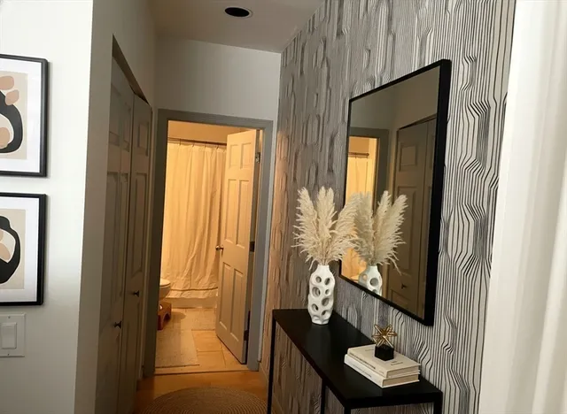 a view of front door with furniture and a window