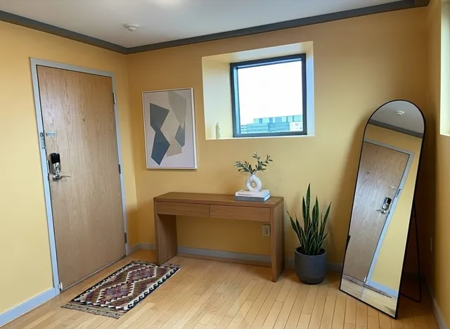 a view of room with window and wooden floor