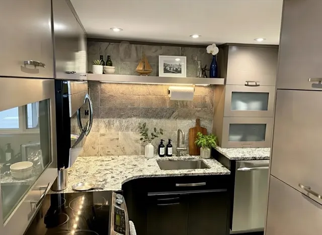 a kitchen with a stove and a refrigerator