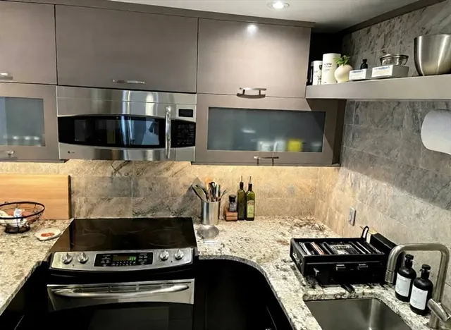 a kitchen with a stove and a microwave