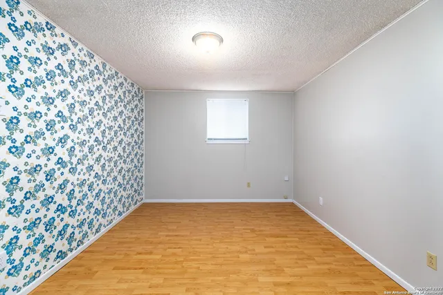 a view of entryway and hall with a fireplace
