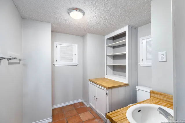 a view of balcony with wooden floor