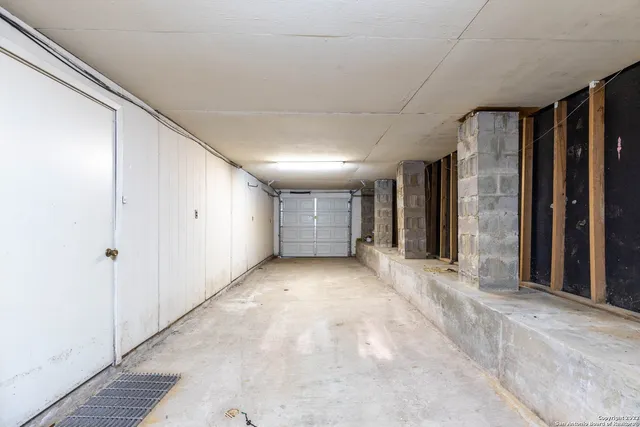 a view of a hallway with bathroom