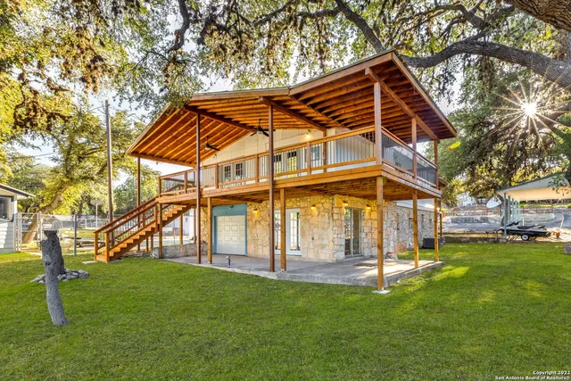 a view of a big yard with palm trees
