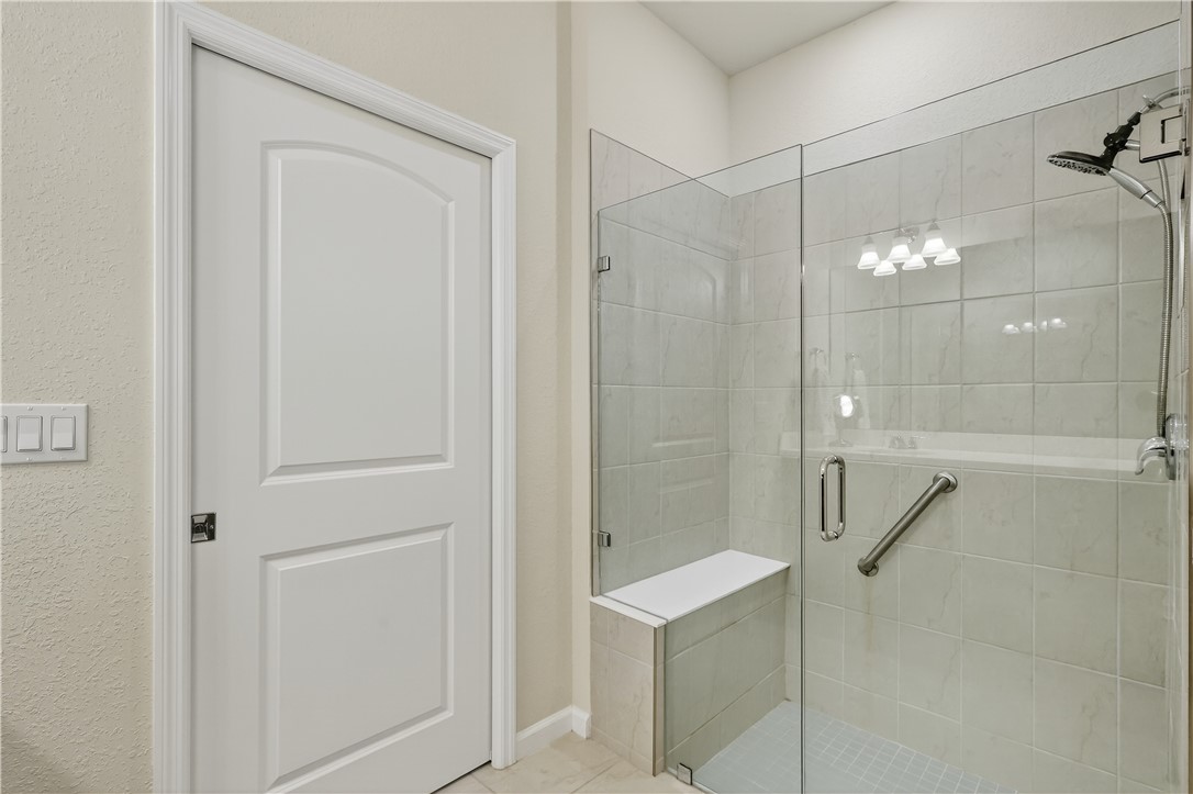5130 Unity Square Vero Beach, FL 32967 - Photo 17 of 36 a bathroom with a shower and a glass door