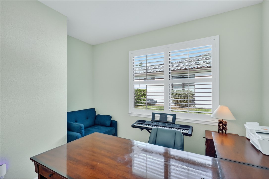 5130 Unity Square Vero Beach, FL 32967 - Photo 21 of 36 a bedroom with furniture and a window
