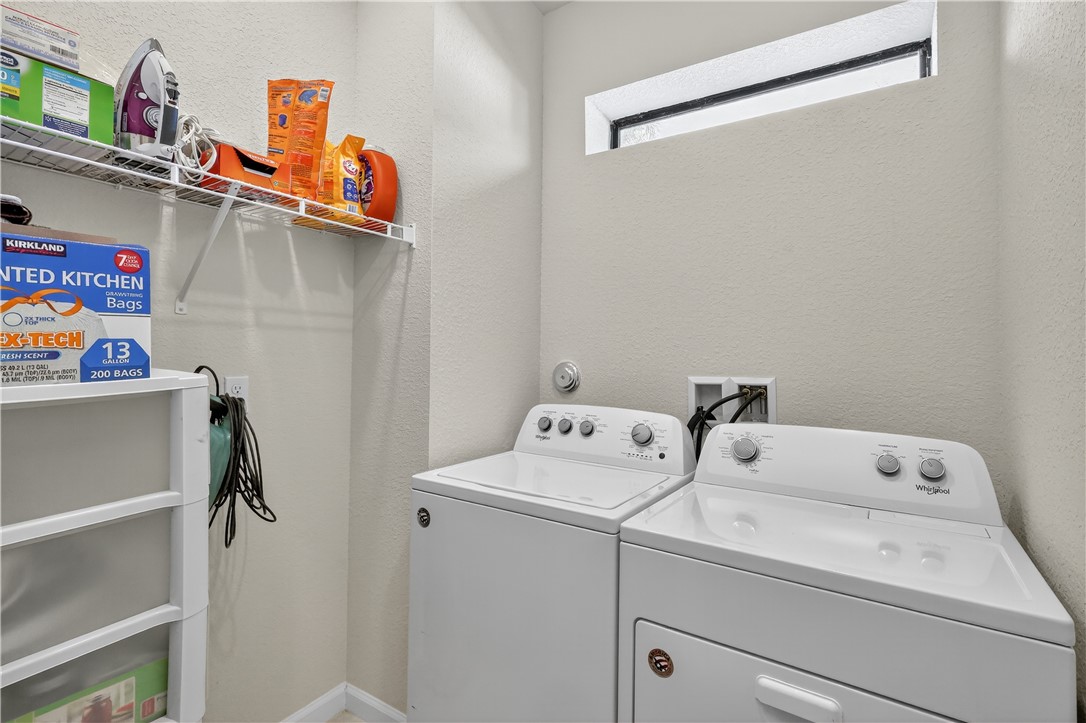 5130 Unity Square Vero Beach, FL 32967 - Photo 23 of 36 a utility room with dryer and washer