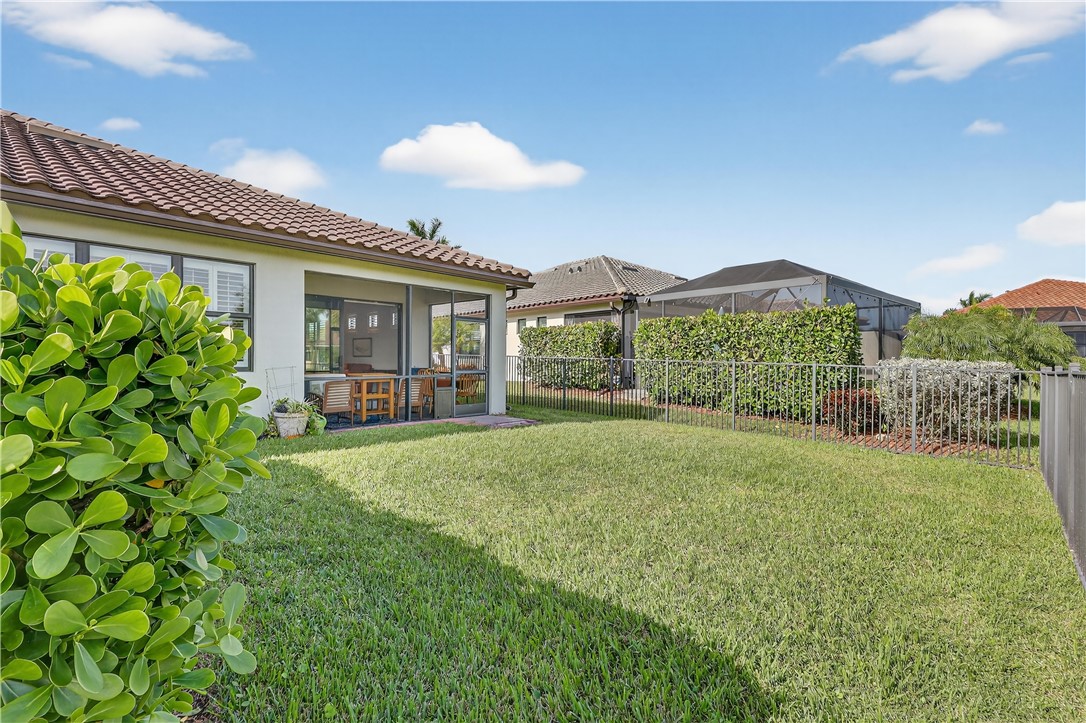 5130 Unity Square Vero Beach, FL 32967 - Photo 26 of 36 a view of a house with yard and porch