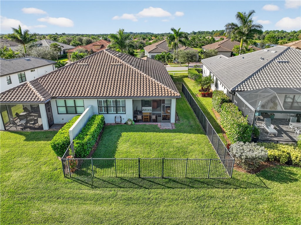 5130 Unity Square Vero Beach, FL 32967 - Photo 29 of 36 a view of a house with a yard