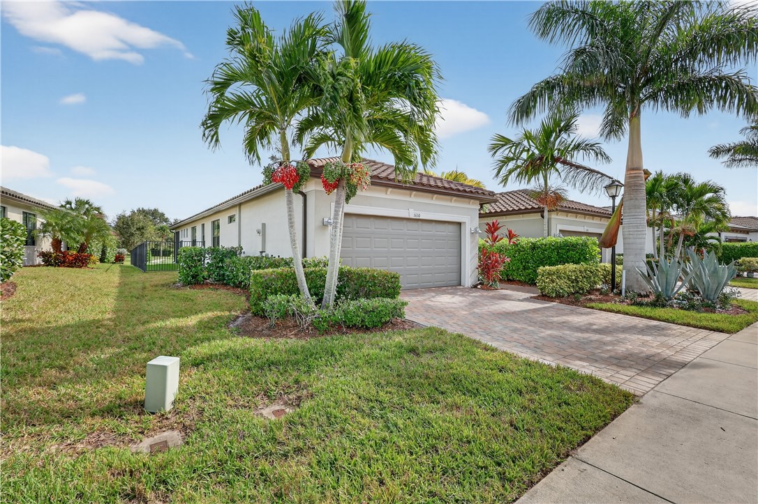 5130 Unity Square Vero Beach, FL 32967 - Photo 3 of 36 a house view with a garden space