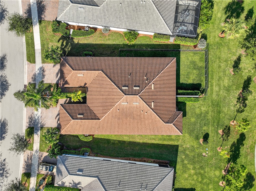 5130 Unity Square Vero Beach, FL 32967 - Photo 32 of 36 an aerial view of a house with a garden and plants