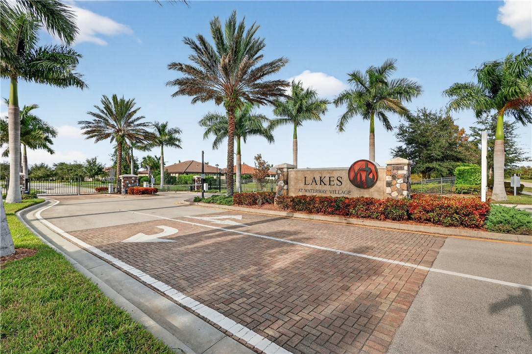 5130 Unity Square Vero Beach, FL 32967 - Photo 34 of 36 a row of palm trees on a park with palm trees