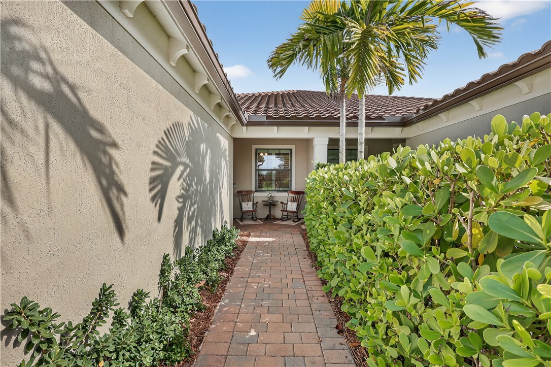 5130 Unity Square Vero Beach, FL 32967 - Photo 4 of 36 a front view of a house with garden